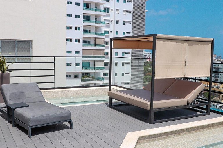 Designer condo near Blue Mall with rooftop pool and city vie
