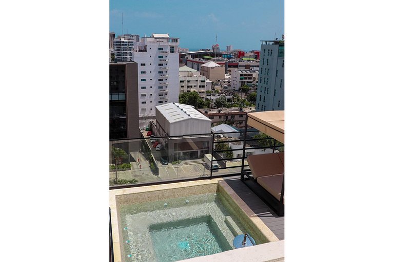 Designer condo near Blue Mall with rooftop pool and city vie
