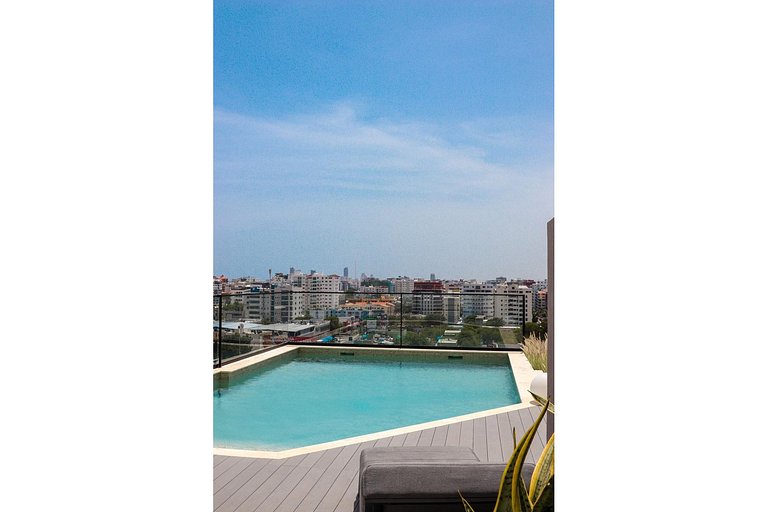 Designer condo near Blue Mall with rooftop pool and city vie