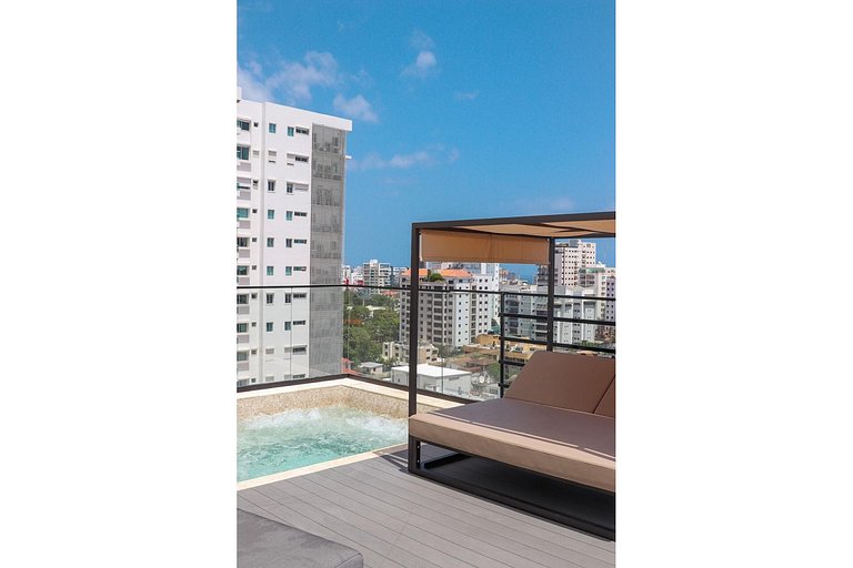 Designer condo near Blue Mall with rooftop pool and city vie