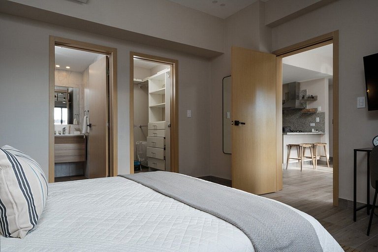 Designer condo near Blue Mall with rooftop pool and city vie