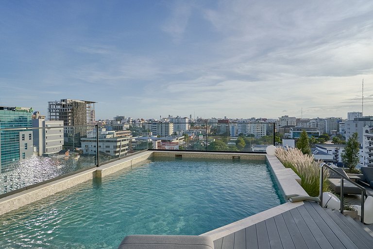 Designer condo near Blue Mall with rooftop pool and city vie
